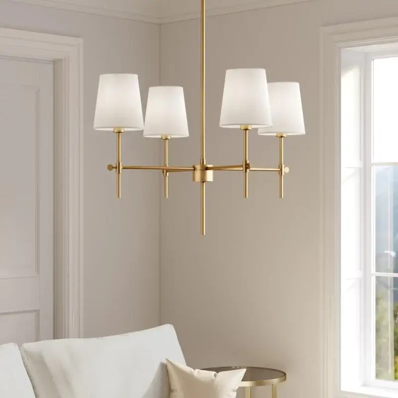 a brass 4 light baker pendant hangs in a modern lounge with taupe colour scheme
