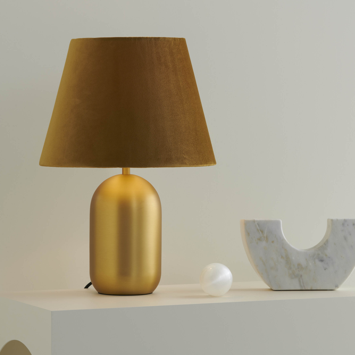 Misty Satin Brass Table Lamp with Gold Shade on table