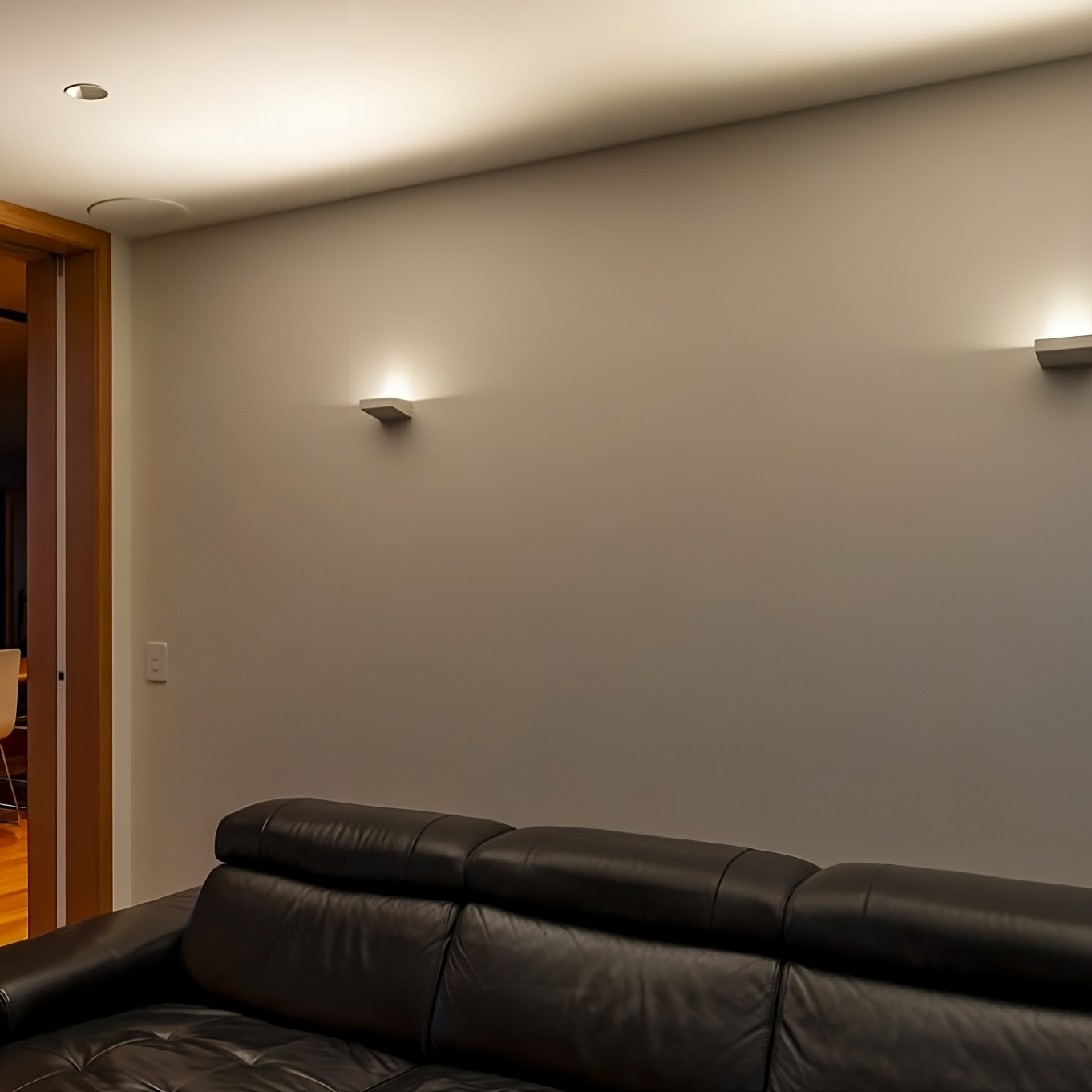image of two cirro wall light is a lounge with the light washing across the ceiling