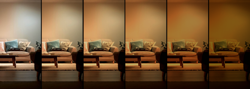 a set of 6 images of the same lounge, in each image the light gets warmer and dimmer giving a visual description of how sunset dim technology works